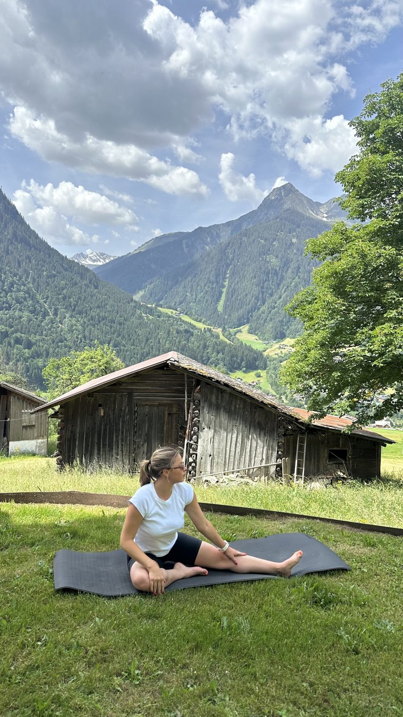 Yoga on a mat in the meadow