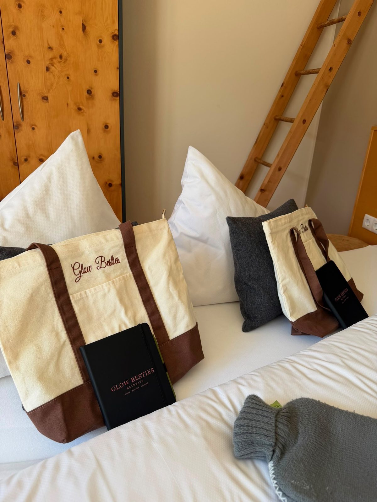 Glow Besties tote bags and notebooks in the room