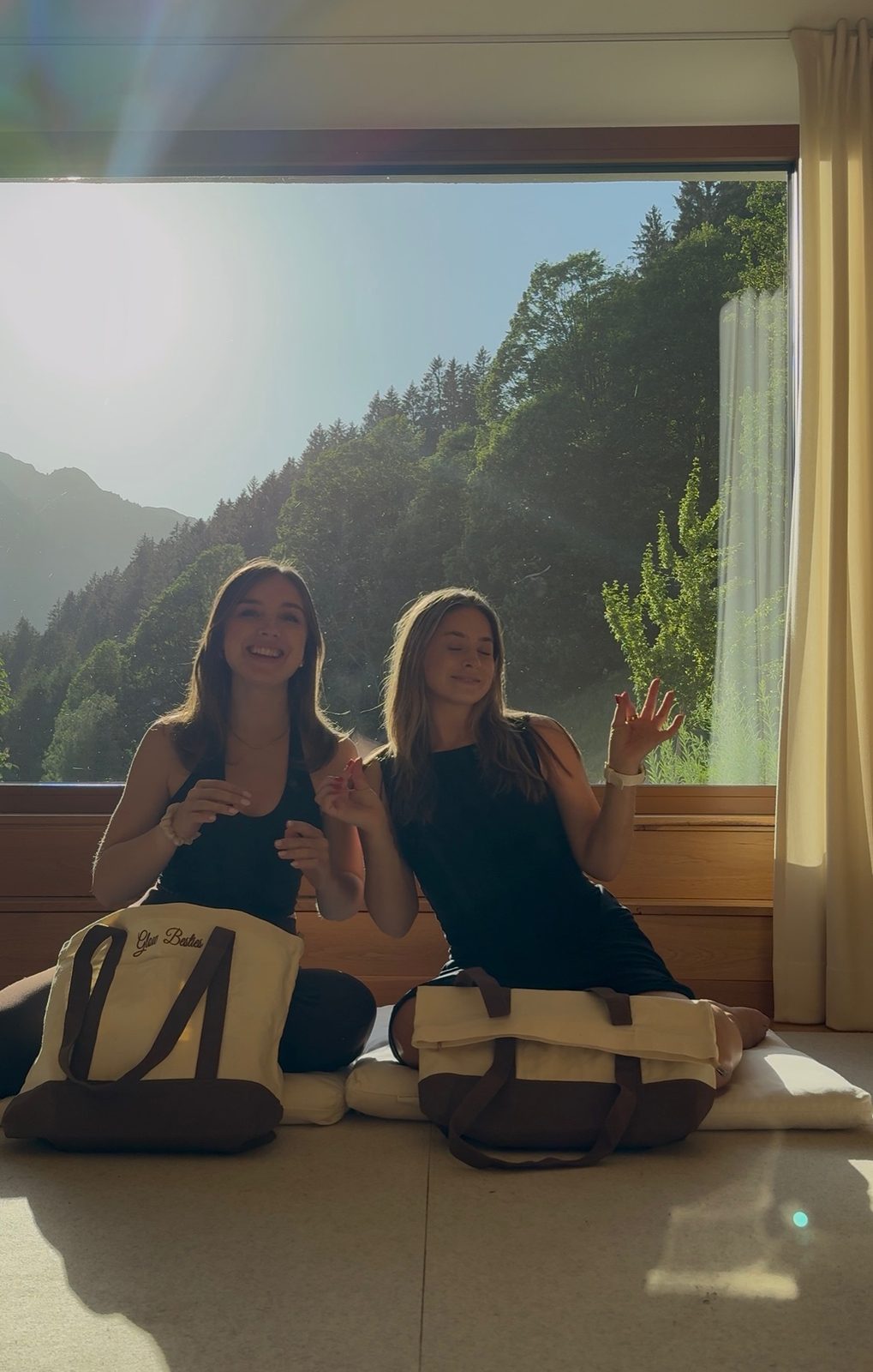 Two guests by the window with the mountain view